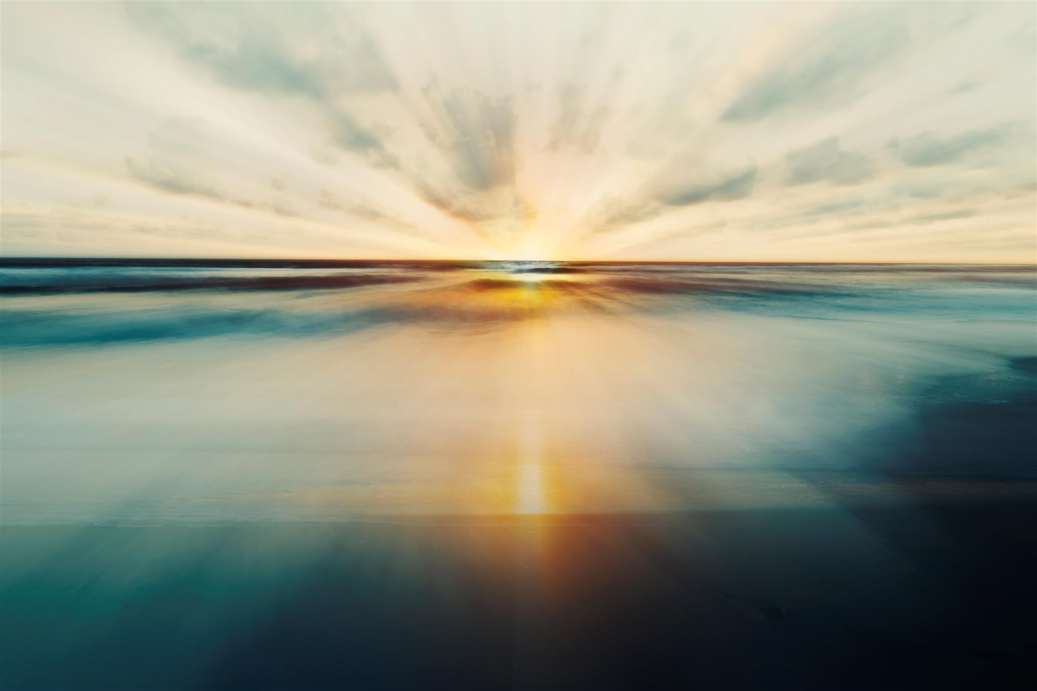Sunrise over calm water
